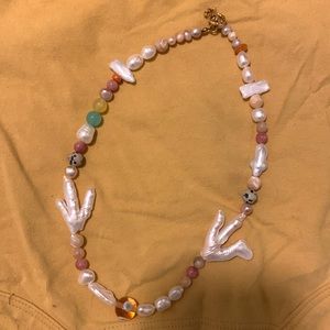 Beautiful hand crafted soft pink and mother of pearl necklace.